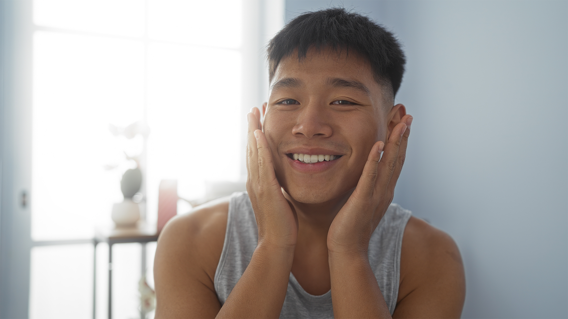 Man moisturising his face